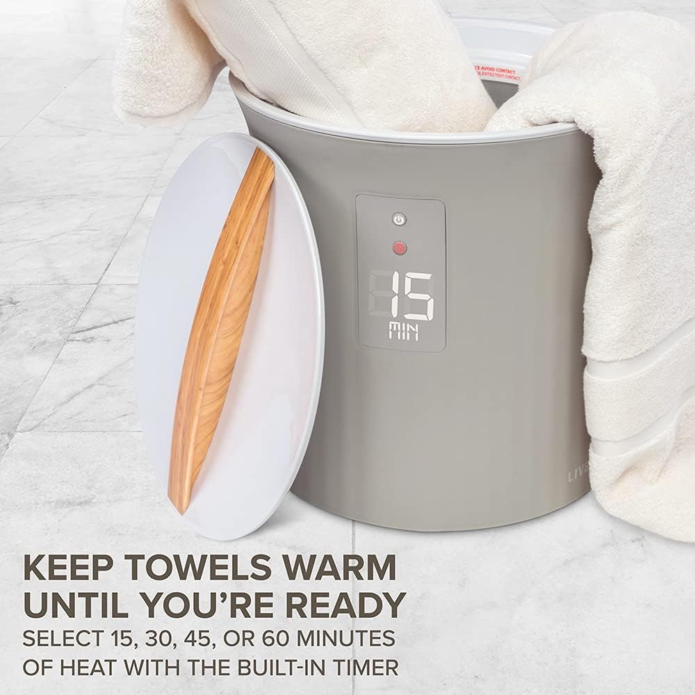 A stylish towel warmer featuring a soft towel, perfect for wrapping yourself in warmth after a refreshing bath.